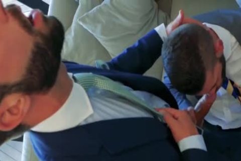 2 Suited males plowing